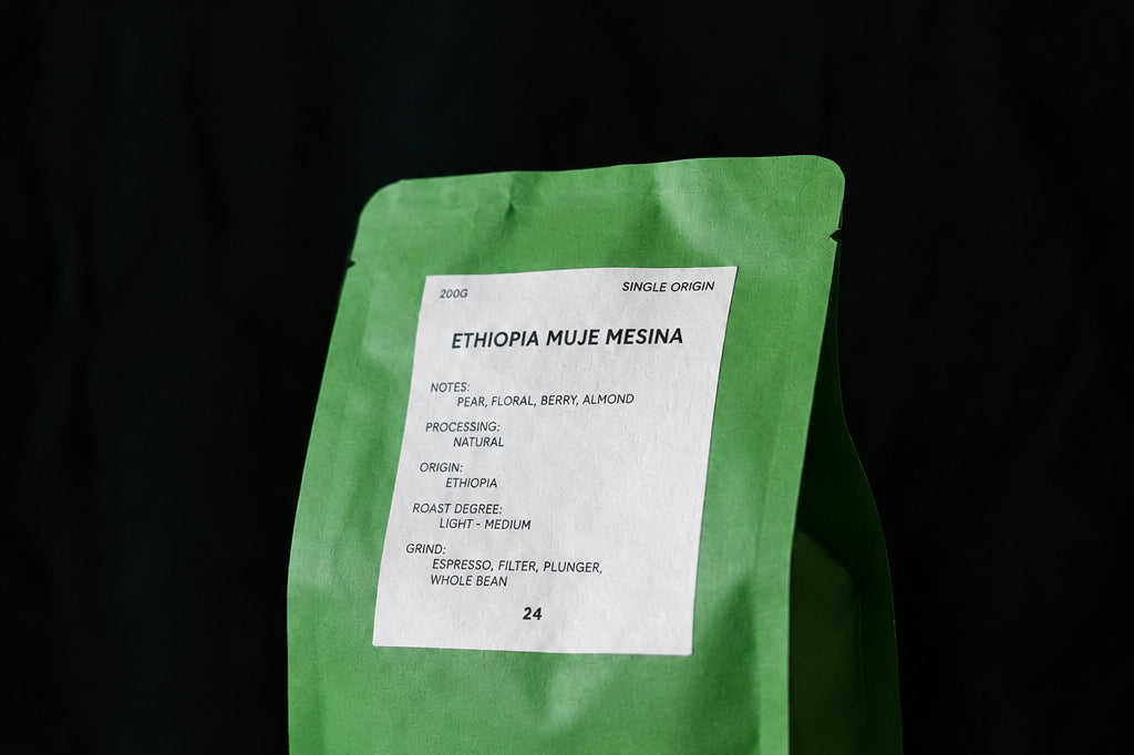 A green bag of Allies coffee, specifically Single Origin Ethiopia Muje Mesina.