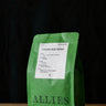 A green bag of Allies coffee, specifically Single Origin Ethiopia Muje Mesina.